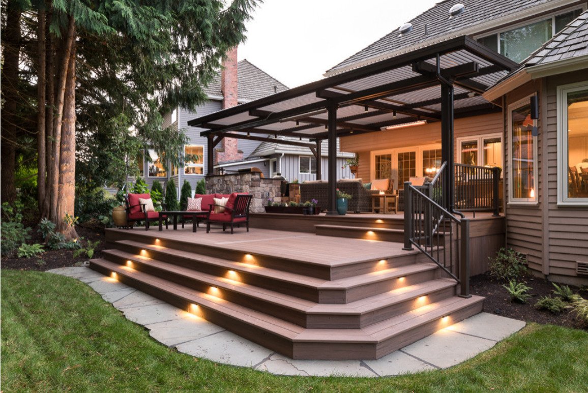 Residential deck with steps and a covered outdoor seating area